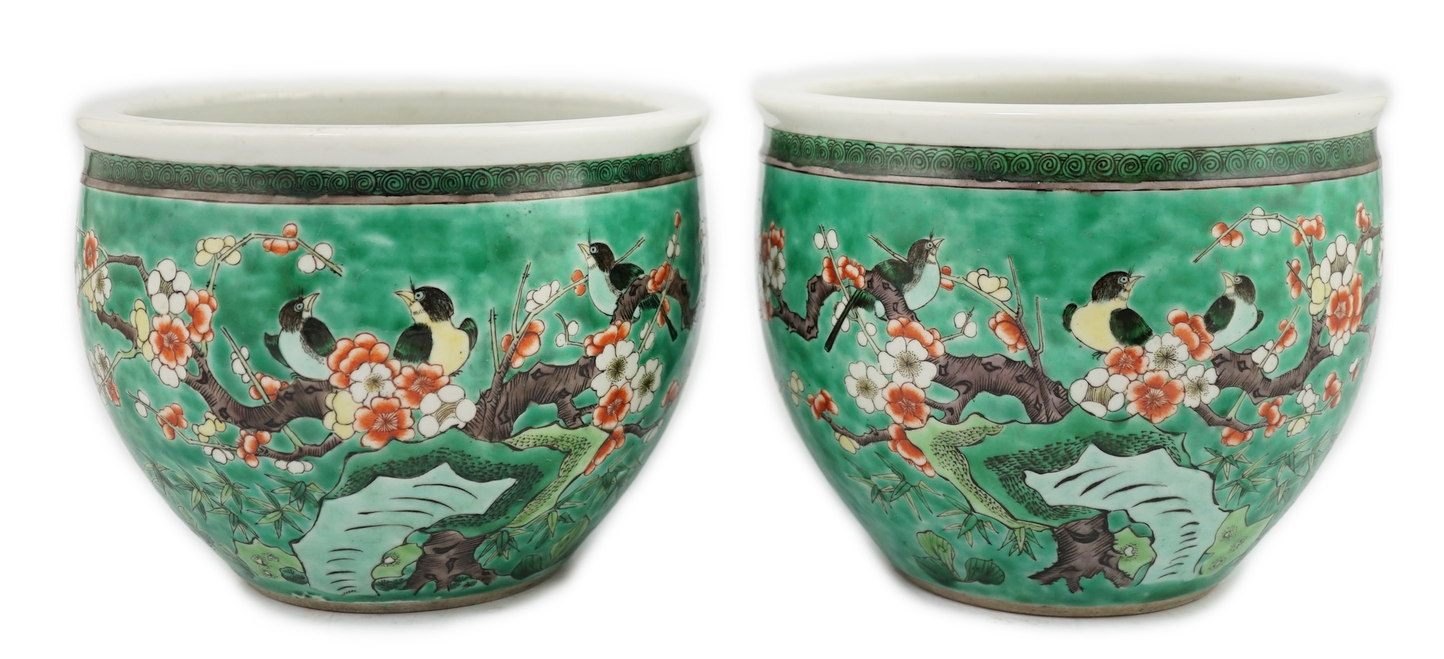 A pair of Chinese famille verte green ground jardinieres, Kangxi marks, but late 19th century